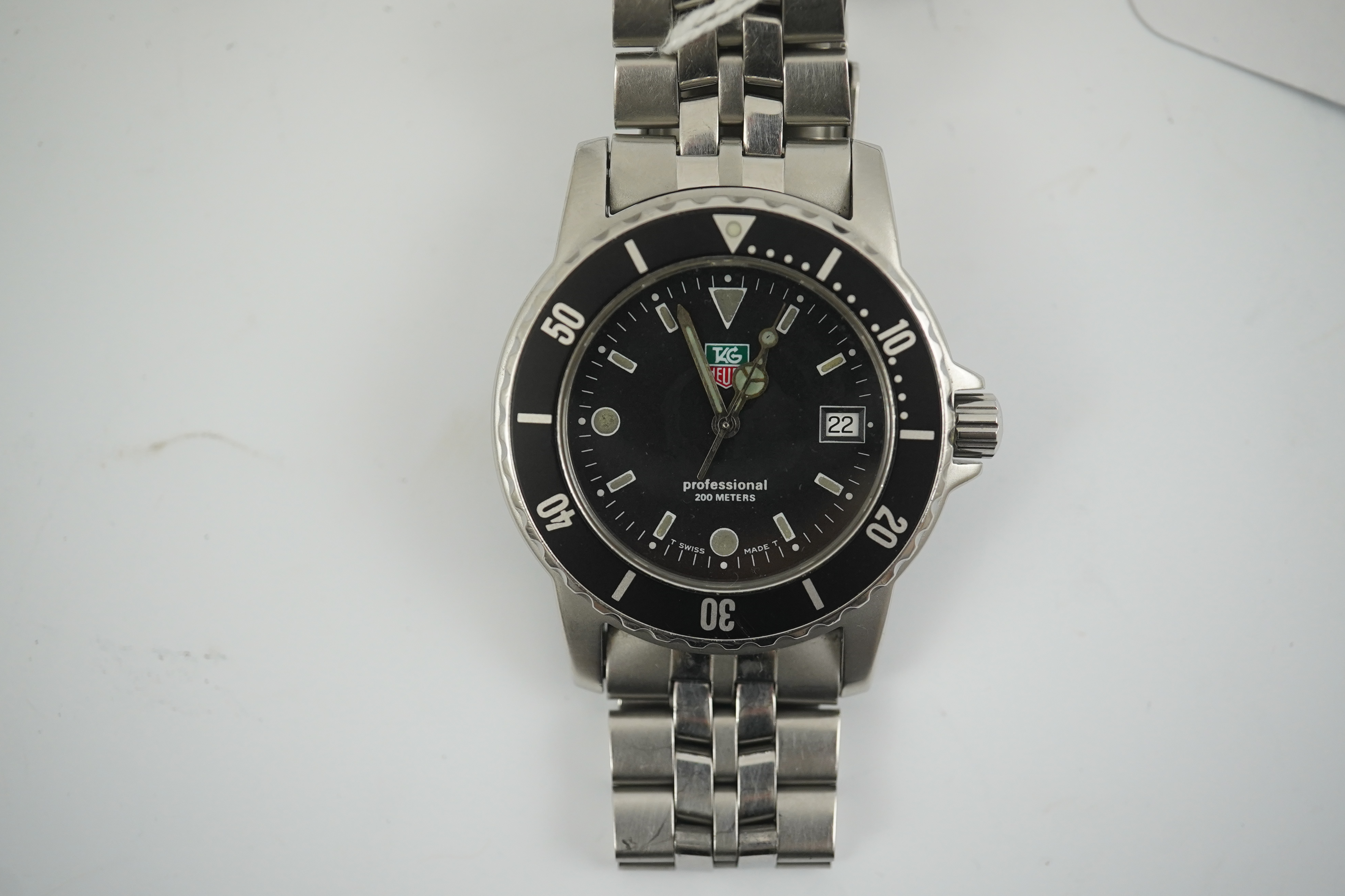 A gentleman's recent stainless steel Tag Heuer Professional quartz wrist watch, on a Tag Heuer stainless steel bracelet